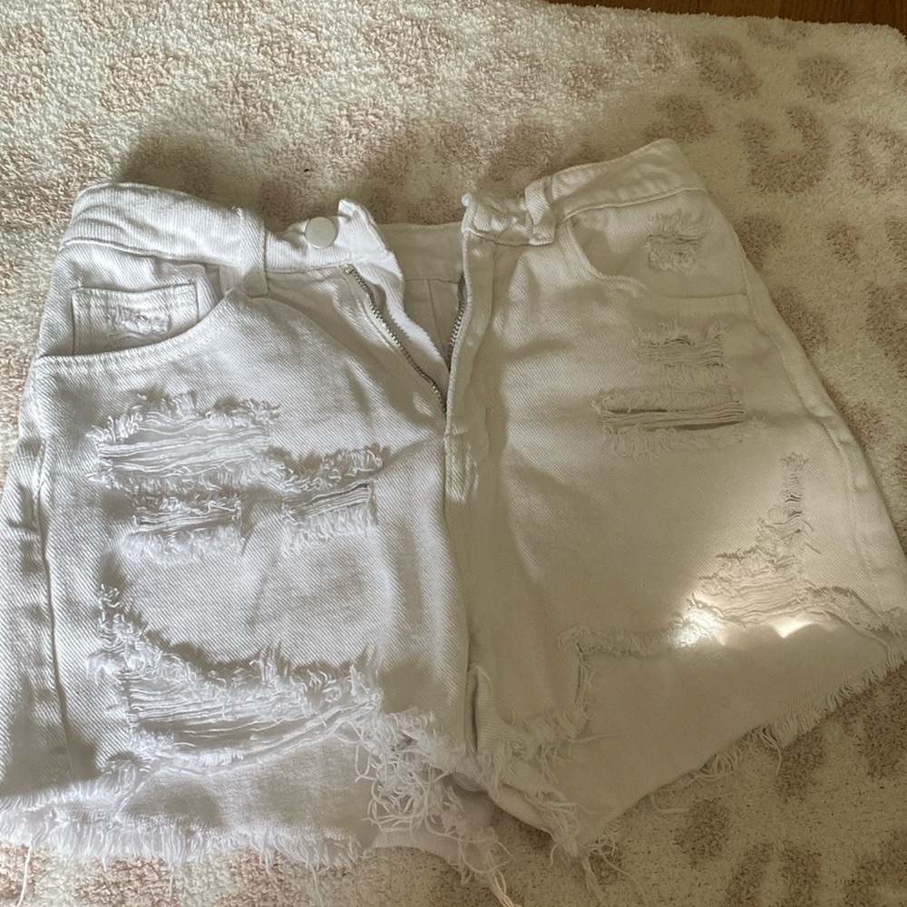 Ripped White pair of jean shorts